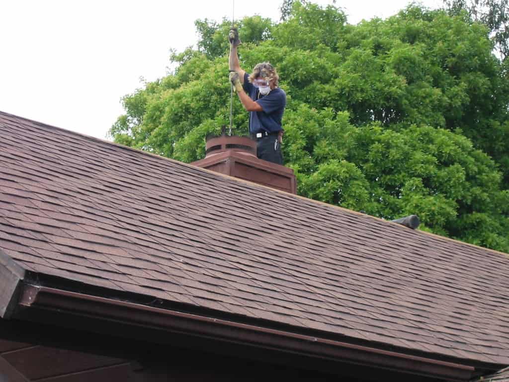 A man cleaning chimney